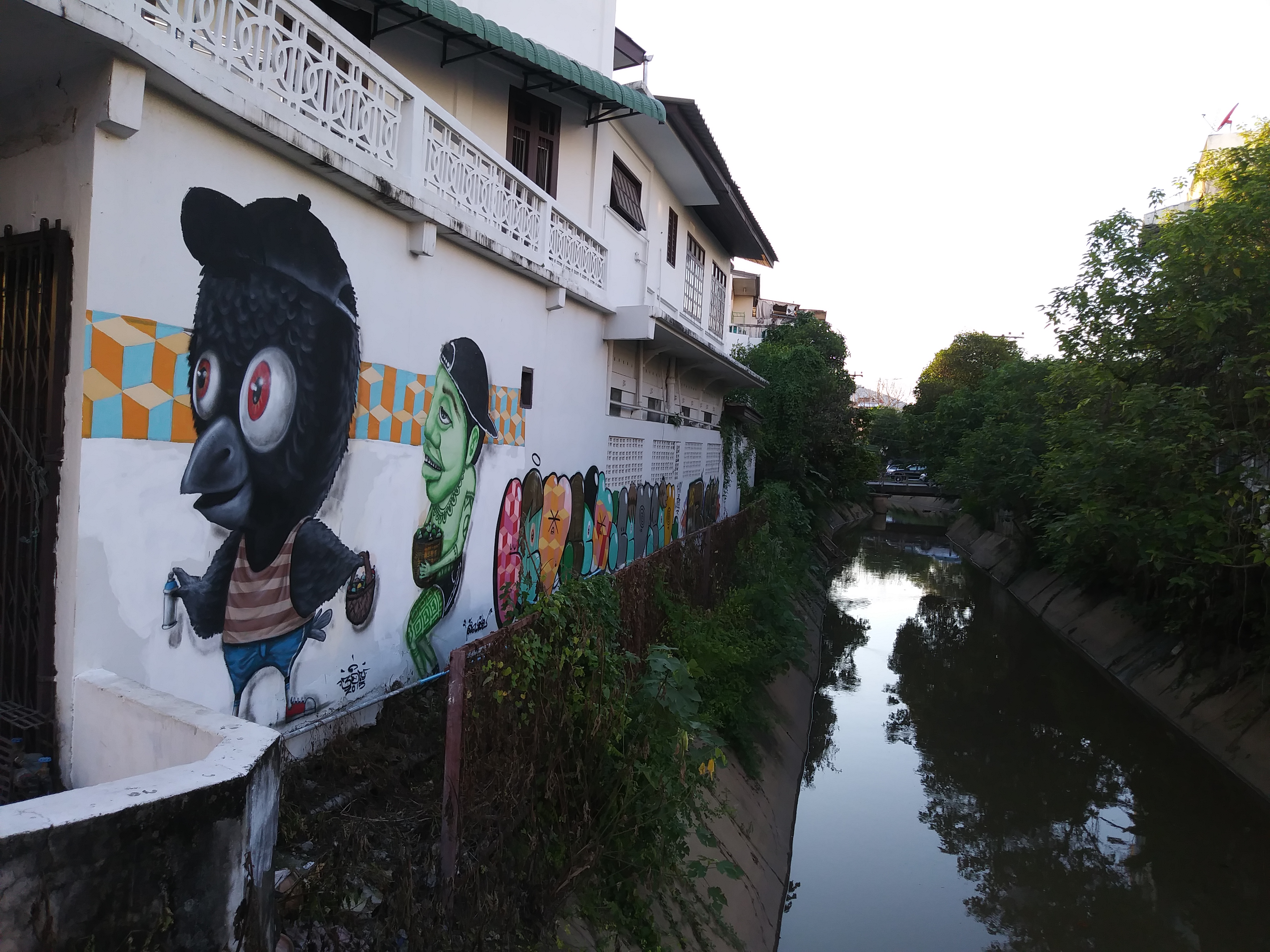 Journey Back To Chiang Mai and Beyond. Mural by the river in Chiang Mai.