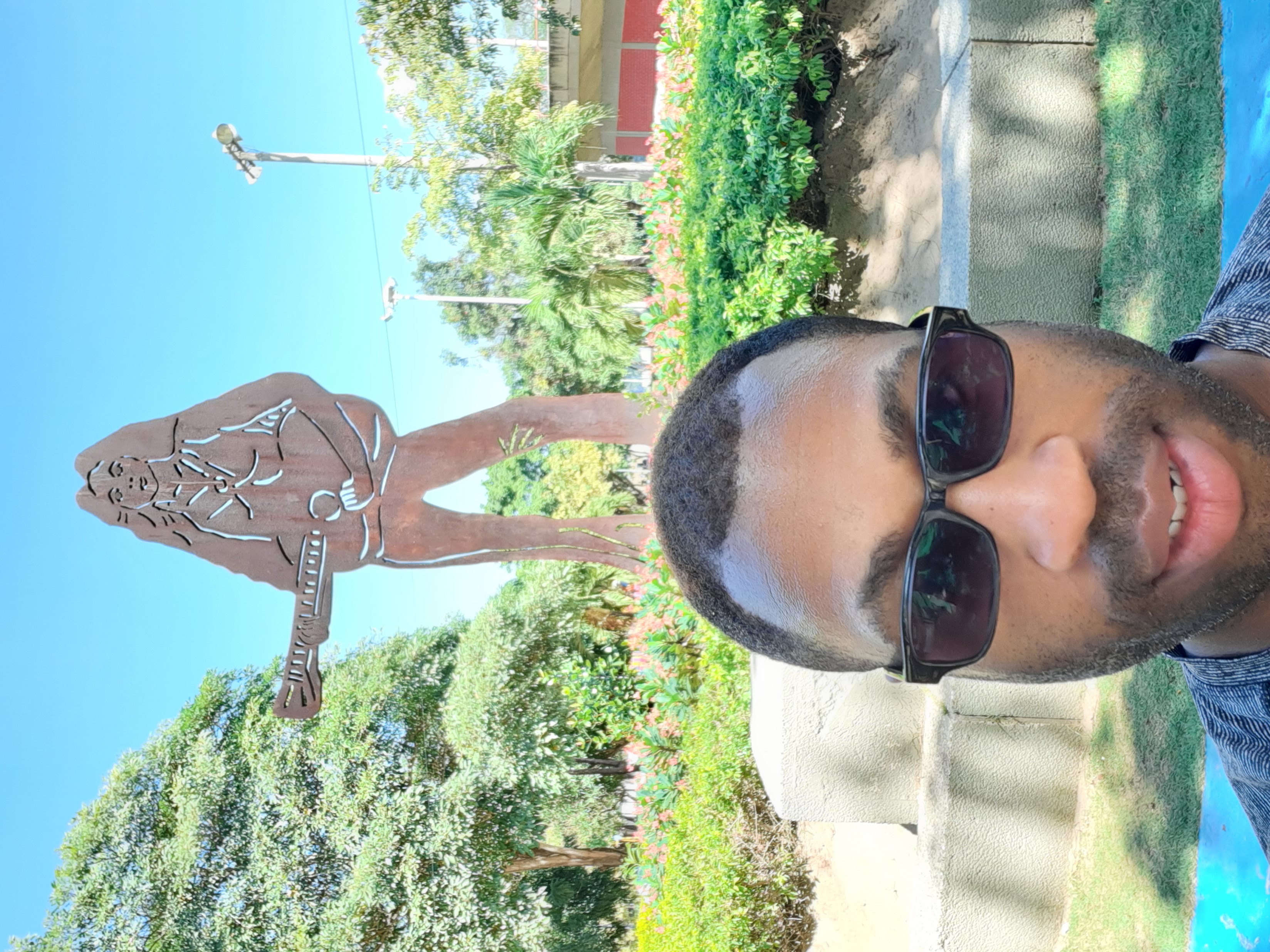 Shakira statue behind me in the park